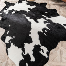 Load image into Gallery viewer, Black &amp; White faux cowhide ride
